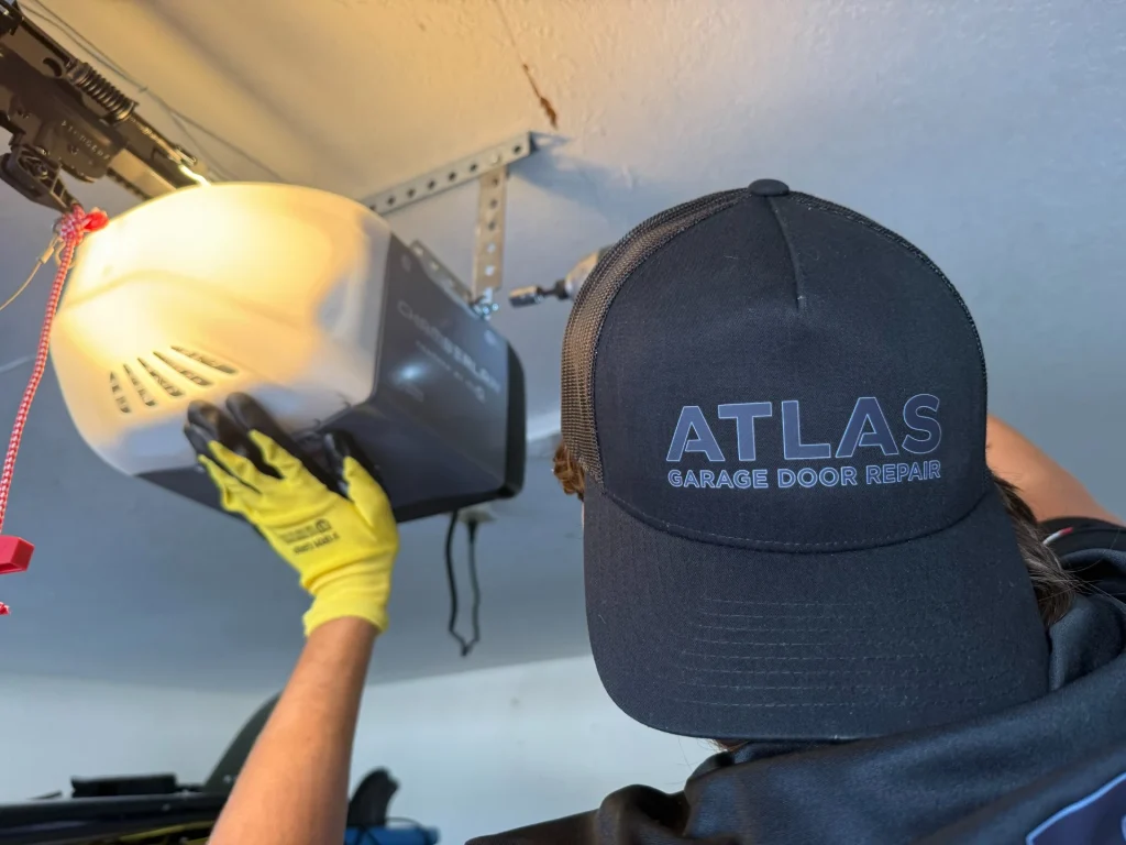 Atlas Garage Door Repair technician standing by a garage door